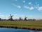 traditional windmills typical of zaanse schans in holland.