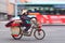 Traditional woman transports stuff on an electric bike, Kunming, china