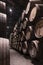 Traditional wooden barrels of wine stored in a wine cellar