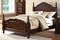 traditional wooden bed, headboard and footboard in dark finish