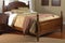 traditional wooden bed, headboard and footboard in dark finish