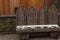 Traditional wooden bench covered with snow central europe vintage