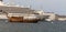 Traditional Wooden Boat Alongside Yacht in Muscat, Oman - March 2023