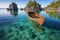 traditional wooden boat anchored near an untouched island