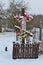 Traditional wooden cross on crossroad in old village of Belarus in winter day