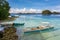 Traditional wooden Filipino boats by the beach of a small island in the sea, Coron Palawan Philippines