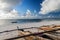 Traditional wooden fishing boats in the East of Zanzibar. Clouds over the Indian Ocean. Gorgeous sunrise over the ocean