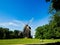 Traditional wooden grain mill moved by the renewable force of the wind, in a northern European country