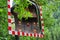 Traditional wooden house reflected in a roadside convex safety mirror near Heiligenblut am Grossglockner, Austria.