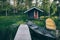 Traditional wooden hut. Finnish sauna on the lake and pier with fishing boats