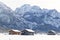 Traditional wooden hut in snow, Alps, Germany, sun flare, reflection