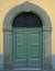Traditional wooden Italian door with stone frame