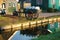 Traditional wooden milk cart loaded with antique containers in front of a stream of water