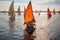 traditional wooden sailboats racing in a regatta