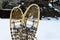 Traditional wooden snowshoes in the snow