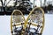 Traditional wooden snowshoes in the snow