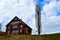 The traditional, wooden, swiss houses with a garden against mountains.