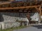 Traditional wooden water fountain in the old town of Malles Venosta, South Tyrol, Italy