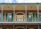 Traditional wrought iron balcony on brick New Orleans house