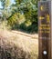 Traditional yellow arrow painted on the way. Direction sign for pilgrims in Saint James way, Camino de Santiago de Compostela,