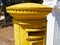 Traditional yellow English post box mailbox Cyprus