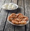 Traditionally, Russian raw and fried pancakes with cottage cheese. Cheesecakes on a wooden rustic table.