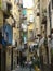 Traditonal street with the suspended laundry to Naples in Italy.