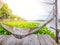 Traditonal thai cuture cradle hanging on the raft at the river water hyacinth.Relax time in the holiday sunnyday.