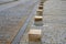 Traffic barrier against the entry of cars or traffic control by means of stone blocks in the square. transport solution in the his
