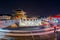 traffic blurs past Janganmun Gate at Hwaseong Fortress in Suwon, South Korea.