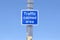 Traffic calmed area road safety sign isolated against blue sky