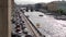 Traffic of cars on the embankment of the Griboyedov Canal and boats on the canal in St. Petersburg, Russia