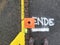 Traffic cone on marker with the word end.