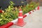 Traffic cone and warning sign on road