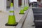 Traffic cones line up in a parking lot