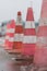 Traffic cones on the wet road. Caution ,danger, warning signs