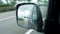 Traffic on German highway - view through rear-view mirror