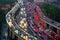 Traffic jam in the rush hour on highway. Cars on bridges and roads in Shanghai Downtown, China at night