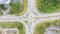 Traffic junctions, modern city. View from above to busy road junction in Malaysia. Colorful cars and trucks driving straight