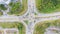 Traffic junctions, modern city. View from above to busy road junction in Malaysia. Colorful cars and trucks driving straight