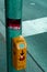 Traffic light button labeled with virus due to the fear of coronavirus