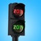 Traffic light with green light 2019 on sky background. Happy new year 2019 concept. 3D rendering isolated on white background