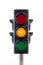 Traffic light isolated on a white background showing an amber light.