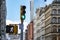 Traffic light and old buildings at an intersection on Broome Street in the SoHo neighborhood of New York City