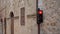 Traffic light on old Italian city burns red. Prohibiting traffic light stop