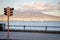 Traffic light is red and green over the sea and the village on the slope of Vesuvius