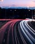 Traffic light trails at dusk down Ryde Road, seen from the Pacific Highway Bridge at Pymble - portrait