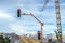 Traffic lights and crane against mountain and sky