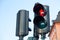 Traffic lights with the red light lit for pedestrians against the sky in Stockholm, Sweden