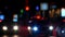 Traffic in night street. Defocused blurs from cars.